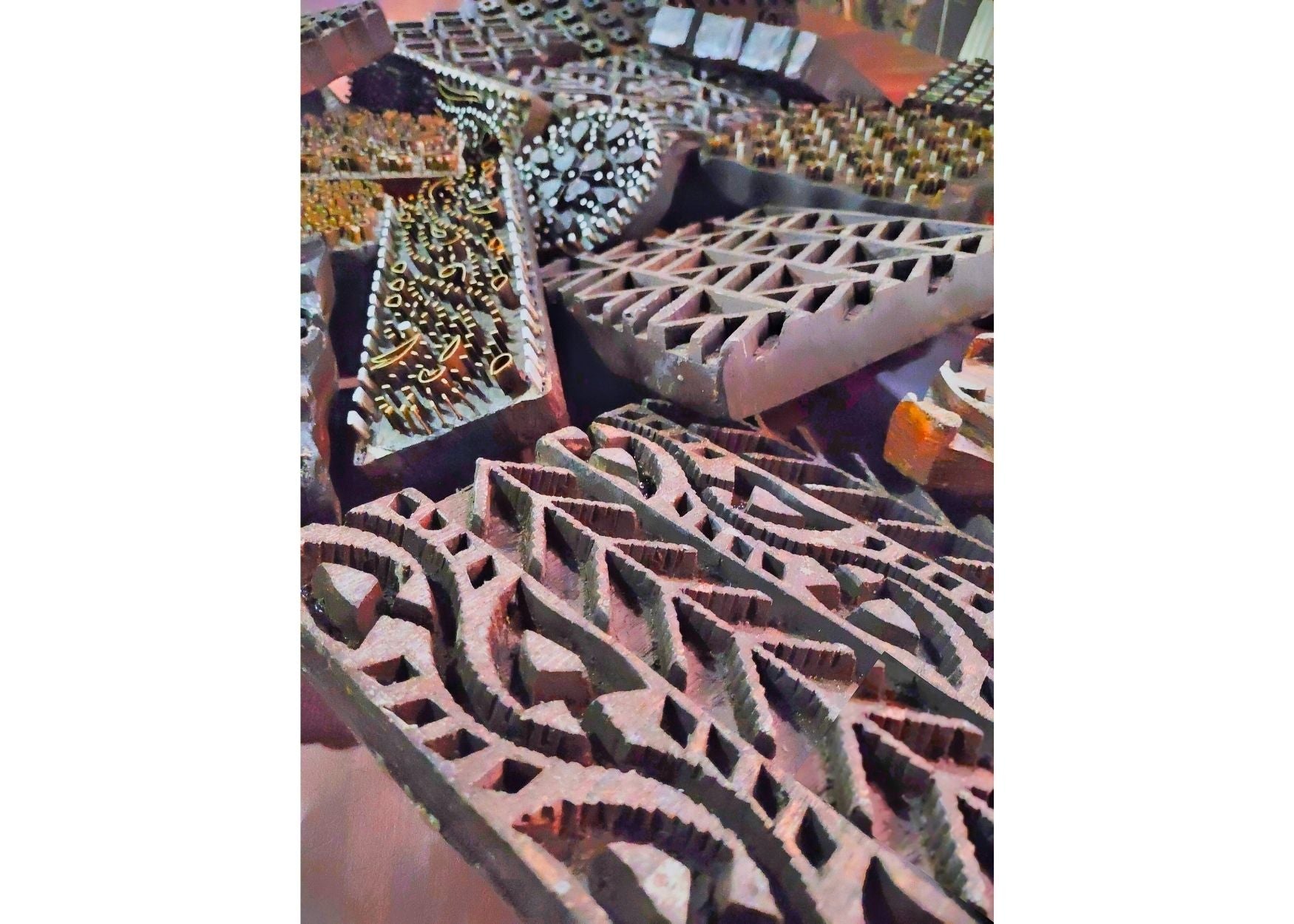 Artisan hand-printing batik fabric with wax
